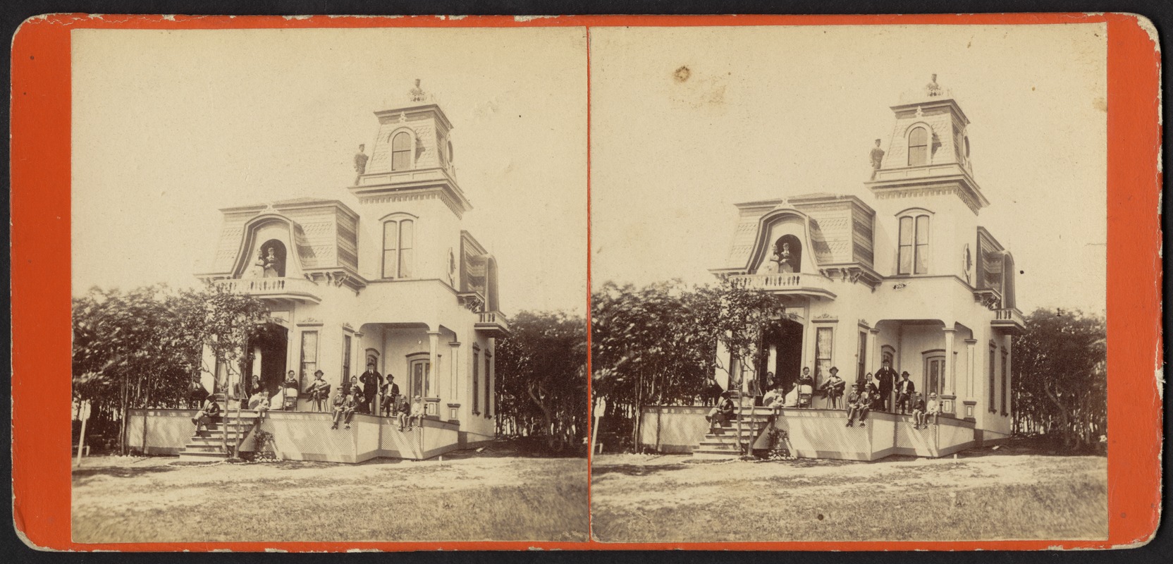 Photograph of people on the steps, porch, balcony, ledge, and roof of a house