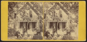 Group photograph of two men, four women, and six children outside a small cottage on Martha's Vineyard
