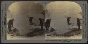 Prospectors burning down a hole, north of the Arctic Circle, Alaska