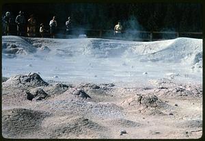 People looking at hot spring, likely Wyoming