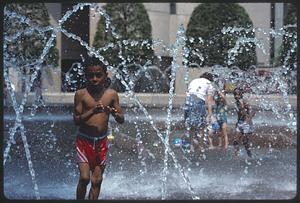 Children cooling off in the fountain at the Christian Science Center, Back Bay
