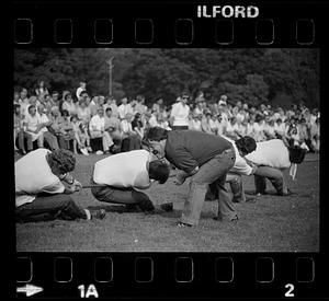 Man yells at tug of war competitors