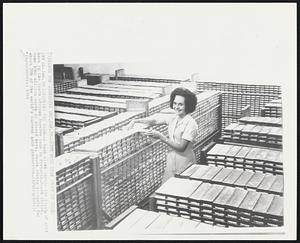 Checking The Bars -- A bank clerk checks the supply of gold bars in the South African Reserve bank in Pretoria, South Africa. Some $560 million worth is stored here. South Africa accounts for about 70% of the world's current gold production.