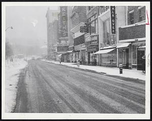 Weather. Blizzards. 1956. Tremont St. near Mason St. looked like this during morning rush hours today. Normally the street is choked with cars. Today's storm, however, prompted thousands of motorists to leave cars at home.