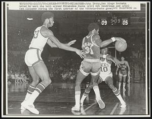 (Bucks-Rockets)-Milwaukee-John Trapp, San Diego Rockets tried to work the ball around Milwaukee Bucks (#10) Bob Dandridge and (#33) Lew Alcindor during the first quarter of the Rockets-Bucks game.