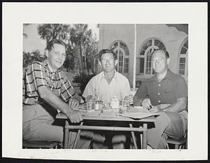 Secretary of Labor Maurice Tobin (left) is shown having lunch at the Hollywood (Fla.) Beach Hotel golf course just before teeing off with Boston friends. In the center is Mr. Max Lampert, 18 Sunset Road, Newton, and on the right, Mr. George Sibley, 90 Baxter Road, Brookline. The Lamperts and Sibleys are vacationing at the Hollywood (Fla.) Beach Hotel.