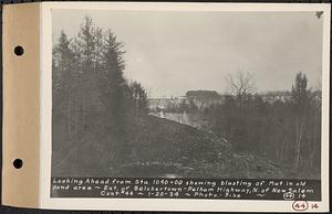 Contract No. 44, Extension of Belchertown-Pelham Highway, New Salem, Orange, looking ahead from Sta. 1040+00 showing blasting of mat in old pond area, New Salem, Mass., Jan. 20, 1934