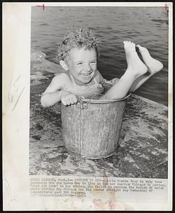 Sitting It Out--Little Sandra Gray is only two-years-old but she knows how to live in the hot weather Chicago is having. "Just sit down" is her advice. She failed to mention the bucket of water she's sitting in. Chicago had its second straight day Wednesday of temperatures past 100 degrees.