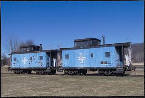 Two blue railroad cars