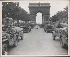 Jeeps of the American 28th Infantry Division move en masse down the Champs Elysees