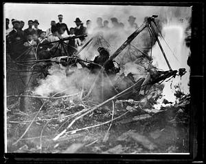 People watching unidentified material on fire