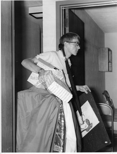 Student with belongings moves into Bentley dormitory, 1969