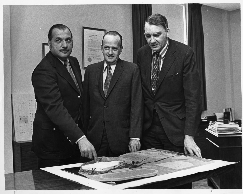 President Gregory Adamian with Robert Weafer and [?] surveying model of Athletic facilities and grounds