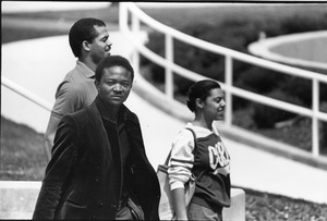 Group walks outdoors on campus Spring 1984