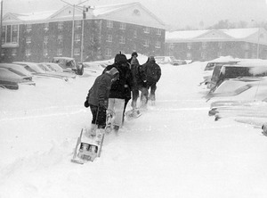 Group of students pull sleds through snow during Blizzard of '78