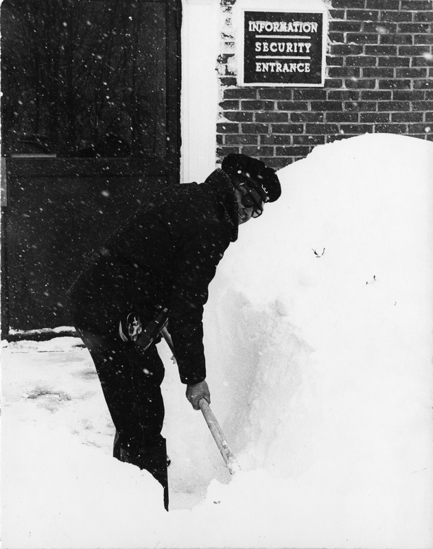 Member of Campus Police shovels snow during Blizzard of '78