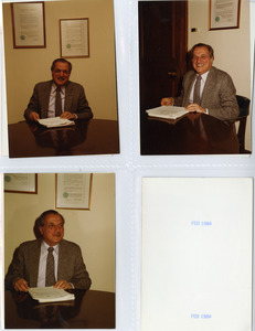 President Gregory Adamian reading papers in his office