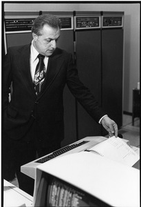 President Gregory Adamian with mainframe computer