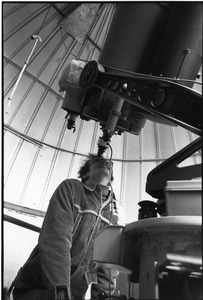 Person looking through telescope at Bentley Observatory