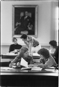 Students studying in Library reserves section