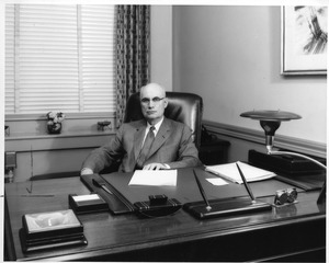 President Maurice Lindsay at his desk