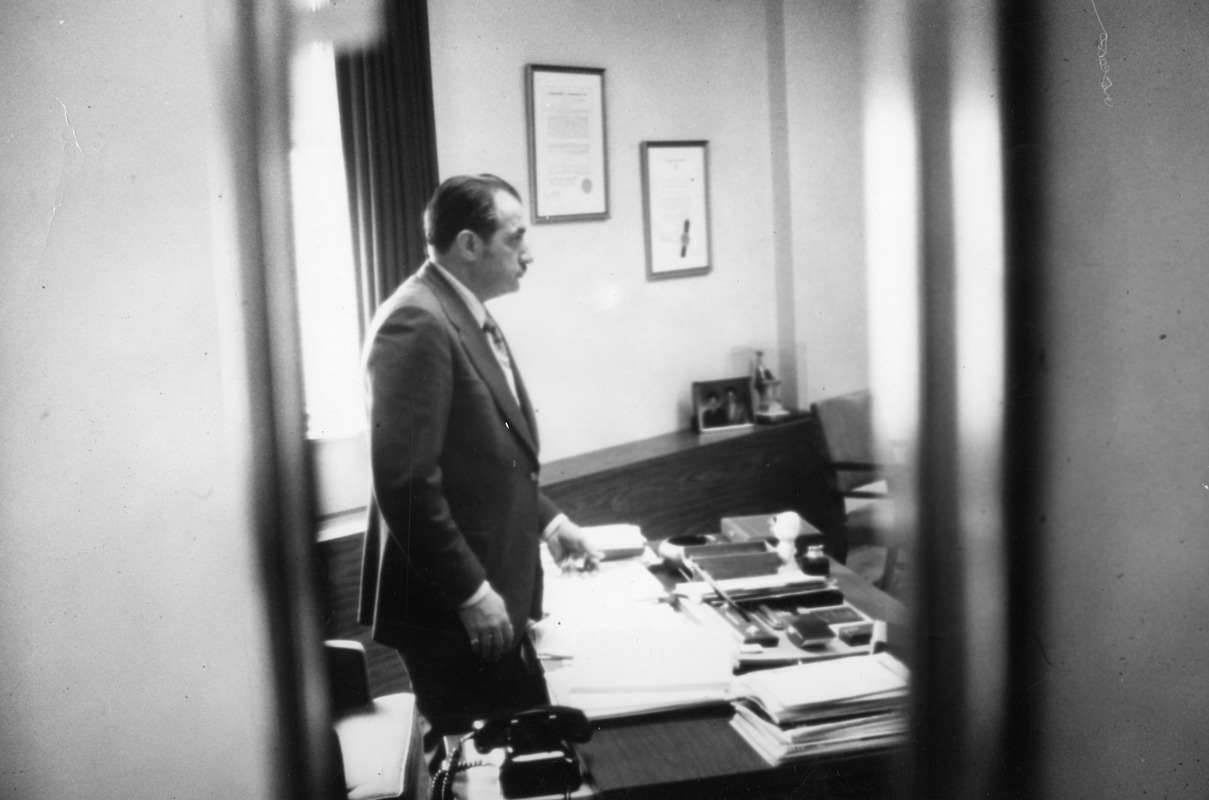 President Gregory Adamian at his desk ca 1970's