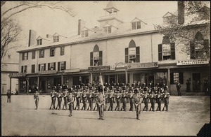 Claflin guards in front of old Nonantum House. Shops: Stiles & Co., stoves & furnaces. H. N. Gleason, grocer. Atwood & Eaton, Elliot Market. Richardson's Boston Express. Joseph M. Briggs, house & sign painter. B. S. Wetherbee, upholsterer. Newton Corner, Newton, MA