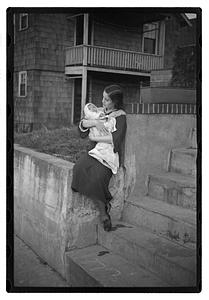 Mercedes Pasarell Sanromá holding a baby