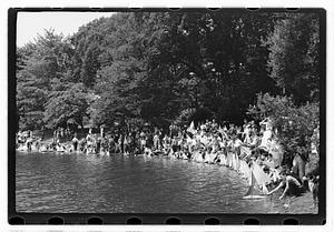 Boys sending out model sailboats