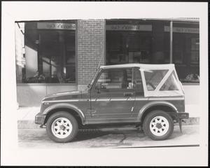 Car in front of Rebecca's Café