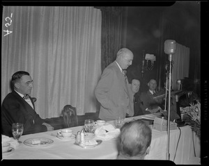 John Shepard III addressing Advertising Club of Boston luncheon held to demonstrate FM transmission at Hotel Statler as Paul DeMars and Linus Travers watch