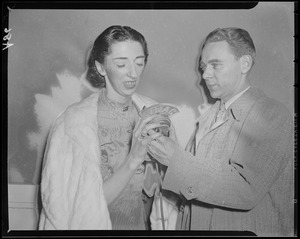 Unidentified woman and man with WNAC microphone