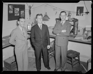 Three unidentified men in photography studio