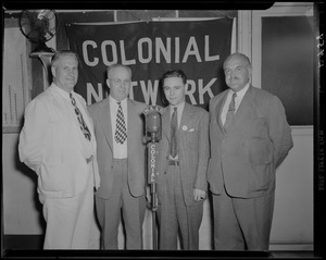 Fore River Shipyard general superintendent John T. Wiseman, left, and three unidentified men during WAAB broadcast