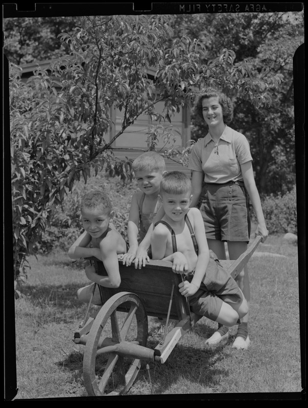 Kids in wheelbarrow