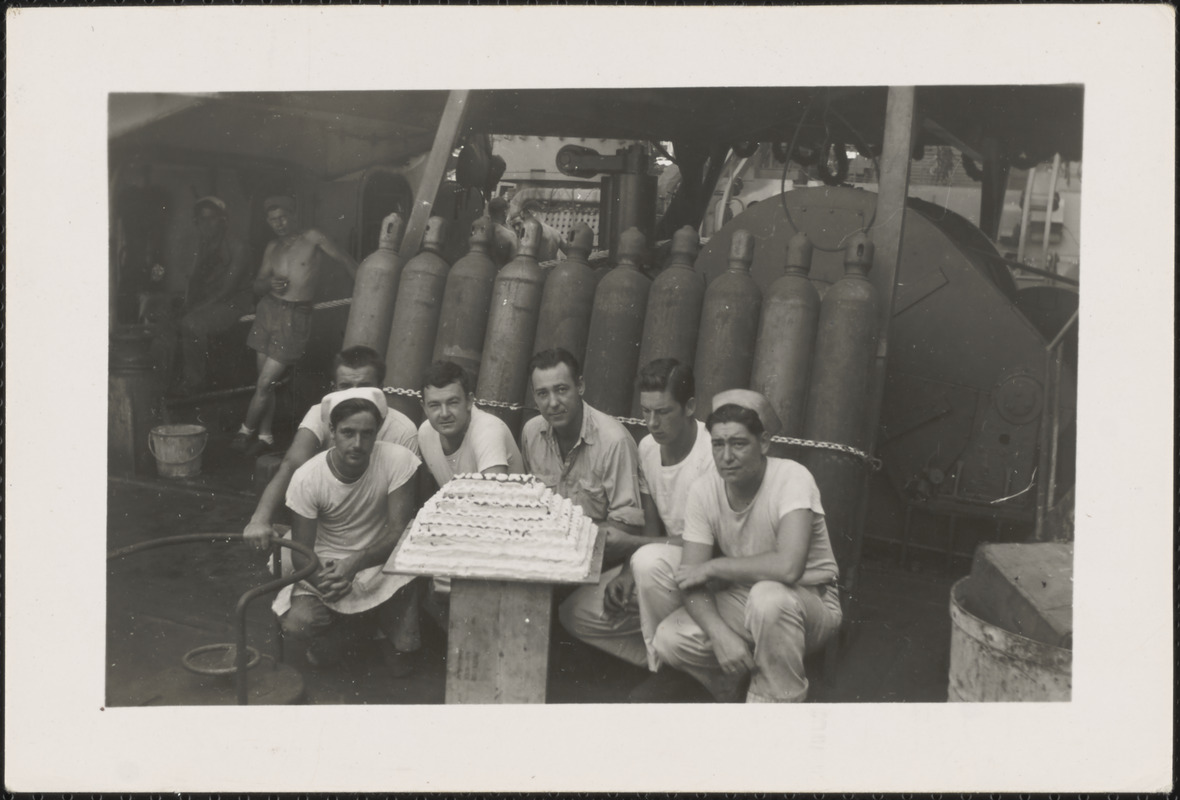 Cooks and victory cake on LST 795