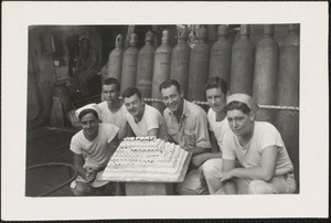 Ship's cooks and victory cake on LST 795