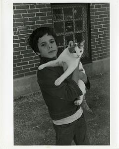 Boy holding a cat