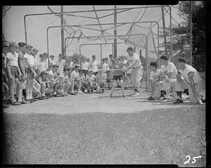 Showing the proper swing at the Archie Allen Baseball School