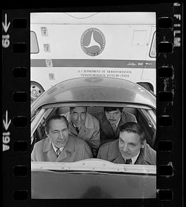 Four commuters in Volkswagen "bug," Boston