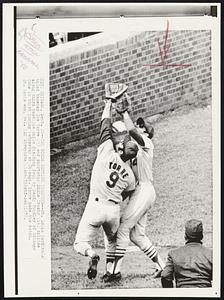 Two Birds Getting Together -- St. Louis Cardinals third baseman Joe Torre (9) and shortstop Eddie Crosby (14) collide along third baseline while fielding foul by Randy Hundley of Chicago Cubs in third inning Wednesday at Chicago. Torre made the catch. St. Louis won, 8-1.