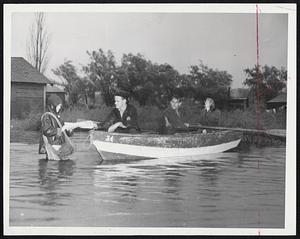 What’s the News?-Residents of the Dunn road section of Revere didn’t have to ask that question as they rowed to meet the paper boy yesterday. The low-lying neighborhood was almost awash under two to four feet of flood water.