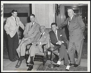 Senators Relax at the Hotel Kenmore while waiting for the weather to clear for tonight's game with the Red Sox at Fenway Park. Left to right, Sam Dente, former Red Sox infielder, Pitcher Sid Hudson, Ed Eynon, Senators' secretary, Pitcher Mickey Harris, another former Red Socker, and Coach Joe Fitzgerald.