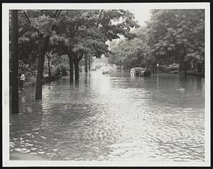 Submarine Alley---Land craft move with caution as ripe tide hits Beacon St., Newton Center.