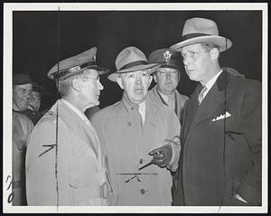 Planning Cape Fire Defense-Strategy to be used in battling the big forest fire on Cape Cod was plotted at Sandwich by Gov. Tobin (right) with Brig.-Gen. William J. Keville (left) of the State Guard and Raymond J. Kenney (in civvies), director of forestry.