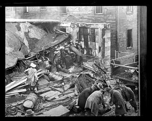 Firefighters at a collapsed building, possibly after an explosion