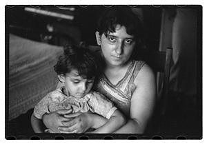 Unidentified woman holding a child