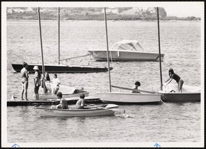 Photograph of small sailboats and youth