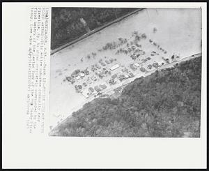 Entire Village Under Flood Waters--This entire suburban community near Pikeville, Ky. is shown completely surrounded by the flood waters of the Levisa Fork of the Big Sandy River today.