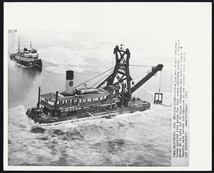 Ice Bound-- Thick ice and frigid temperatures spelled slow going for this crane-carrying barge. A tugboat moved in to help out in upper Chesapeake Bay where a number of vessels have become ice-impacted in the current cold spell.